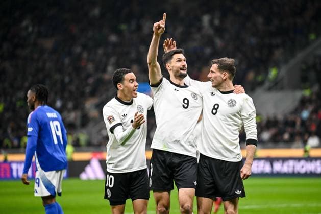Jamal Musiala Germany , Leon Goretzka Germany and Tim Kleindienst Germany celebrates after scoring his team s first goal with teammates during the UEFA Nations League quarterfinal leg one match between Italy and Germany at Stadio San Siro on March 20, 2025 in Milan, Italy Photo by Harry Langer DeFodi Images