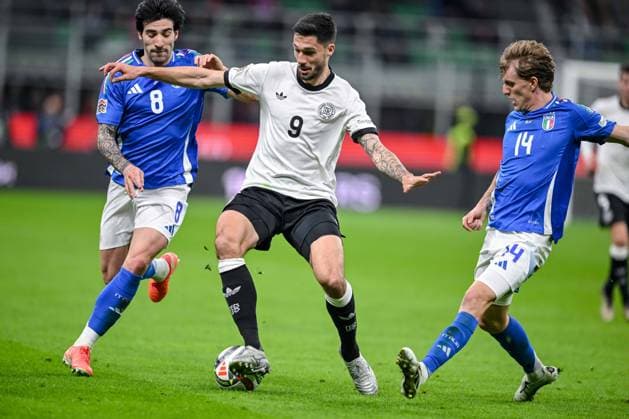 Sandro Tonali Italy , Tim Kleindienst Germany and Nicolo Rovella Italy battle for the ball during the UEFA Nations League quarterfinal leg one match between Italy and Germany at Stadio San Siro on March 20, 2025 in Milan, Italy Photo by Harry Langer DeFodi Images