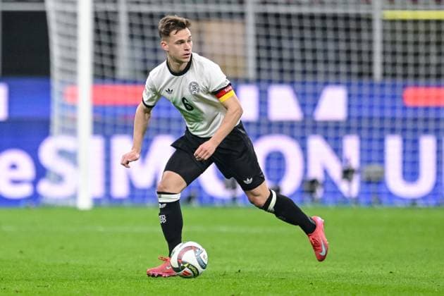 Joshua Kimmich Germany controls the ball during the UEFA Nations League quarterfinal leg one match between Italy and Germany at Stadio San Siro on March 20, 2025 in Milan, Italy Photo by Harry Langer DeFodi Images