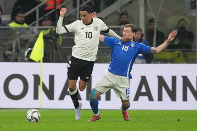 Jamal Musiala Germany, Germany, 10 v Nicolo Barella Italy, Italy, Italia, 18 Milan 20 03 2025 Italy v Germany, Nations League quarter-final first leg, San Siro