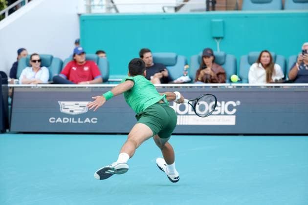 March 21, 2025, Miami Gardens, Florida, United States Of America: MIAMI GARDENS, FLORIDA - MARCH 21: Novak Djokovic of Serbia defeats Rinky Hijikata of Australia during Day 4 of the Miami Open at Hard Rock Stadium on March 21, 2025 in Miami Gardens, Florida. ...People: Novak Djokovic Miami Open 2025 - Day 4  - ZUMAs214 20250321_ada_s214_031 Copyright: xSMGx