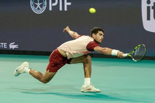 March 21, 2025, Miami, Florida, USA: Carlos Alcaraz (ESP) returns a shot to David Goffin (not pictured) during the mens singles second round at the 2025 Miami Open presented by Itau at Hard Rock Stadium. Miami USA - ZUMAw109 20250321_fap_w109_013 Copyright: xDebbyxWongx
