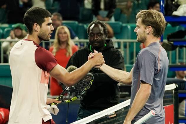 March 21, 2025, Miami, Florida, USA: David Goffin (BEL)(R) shakes hands with Carlos Alcaraz (ESP) after winning the mens singles second round at the 2025 Miami Open presented by Itau at Hard Rock Stadium. Miami USA - ZUMAw109 20250321_fap_w109_019 Copyright: xDebbyxWongx