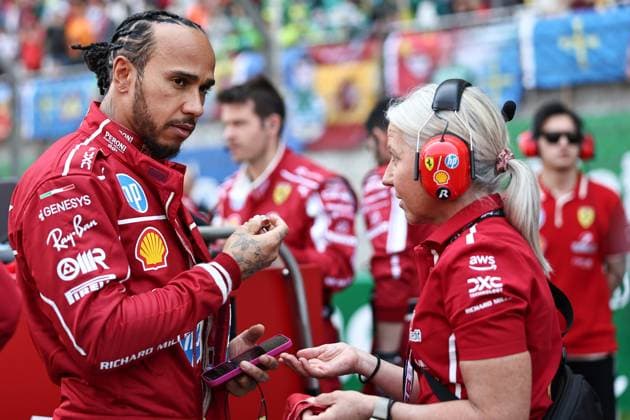 F1 Grand Prix Of China - Sprint & Qualifying Lewis Hamilton of Great Britain and Scuderia Ferrari talks with his physio Angela Cullen during the Sprint ahead of the F1 Grand Prix of China at Shanghai International Circuit in Shanghai, China, on March 22, 2025. Shanghai Shanghai China  Copyright: xPaddockerx originalFilename:paddocker-f1grandp250322_npBHS.jpg