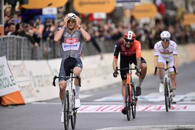 Dutch Mathieu van der Poel of Alpecin-Deceuninck (L) celebrates as he wins before Italian Filippo Ganna of Ineos Grenadiers (C) and Slovenian Tadej Pogacar of UAE Team Emirates (R) the sprint at the finish of the Milano-Sanremo one day cycling race for men, 289km from Milan to Sanremo, Italy, Saturday 22 March 2025. DIRKxWAEM  x115413197x