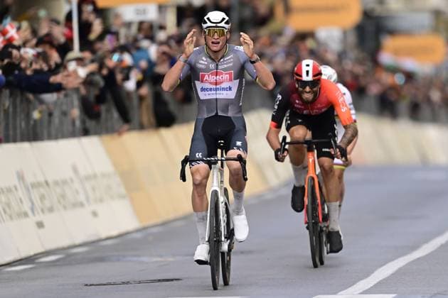 Dutch Mathieu van der Poel of Alpecin-Deceuninck (C) celebrates as he wins before Italian Filippo Ganna of Ineos Grenadiers (R) the sprint at the finish of the Milano-Sanremo one day cycling race for men, 289km from Milan to Sanremo, Italy, Saturday 22 March 2025. DIRKxWAEM  x115413709x