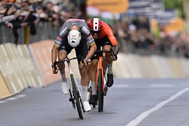 Dutch Mathieu van der Poel of Alpecin-Deceuninck (C) wins before Italian Filippo Ganna of Ineos Grenadiers (R) the sprint at the finish of the Milano-Sanremo one day cycling race for men, 289km from Milan to Sanremo, Italy, Saturday 22 March 2025. DIRKxWAEM  x115413729x