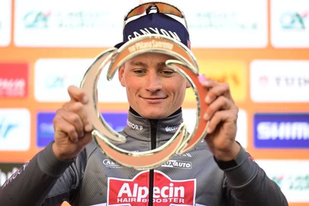 Dutch Mathieu van der Poel of Alpecin-Deceuninck celebrates on the podium with the trophy after winning the Milano-Sanremo one day cycling race for men, 289km from Milan to Sanremo, Italy, Saturday 22 March 2025. DIRKxWAEM  x115414594x
