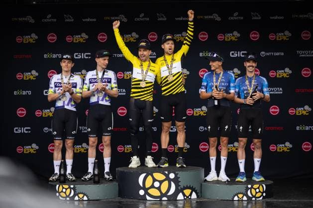 Switzerland s Nino Schurter and Filippo Colombo celebrate on the podium after winning the eight-day Cape Epic mountain bike pairs stage race in South Africa, Lourensford, March 23, 2025. (CTKxPhoto MichalxCerveny) CTKPhotoF202503230004601  CTKPhotoF202503230004601