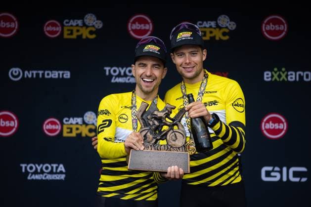 Switzerland s Nino Schurter and Filippo Colombo celebrate after winning the eight-day Cape Epic mountain bike pairs stage race in South Africa, Lourensford, March 23, 2025. (CTKxPhoto MichalxCerveny) CTKPhotoF202503230004701  CTKPhotoF202503230004701