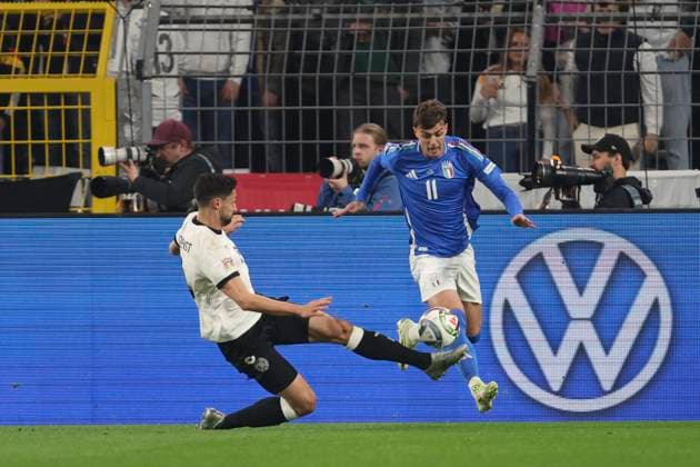 Tim Kleindienst Germany and Daniel Maldini Italy battle for the ball during the UEFA Nations League Quarterfinal Leg Two match between Germany and Italy at Football Stadium Dortmund on March 23, 2025 in Dortmund, Germany Photo by Oliver Kaelke DeFodi Images