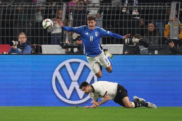 Tim Kleindienst Germany and Daniel Maldini Italy battle for the ball during the UEFA Nations League Quarterfinal Leg Two match between Germany and Italy at Football Stadium Dortmund on March 23, 2025 in Dortmund, Germany Photo by Oliver Kaelke DeFodi Images