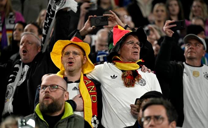 23 03 2025, Football UEFA Nations League 2024 25, quarter-final, Germany Italy, in Dortmund, Signal Iduna Stadium, Germany fans sing along to the national anthem
