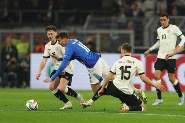 Daniel Maldini Italy and Nico Schlotterbeck Germany battle for the ball during the UEFA Nations League Quarterfinal Leg Two match between Germany and Italy at Football Stadium Dortmund on March 23, 2025 in Dortmund, Germany Photo by Oliver Kaelke DeFodi Images