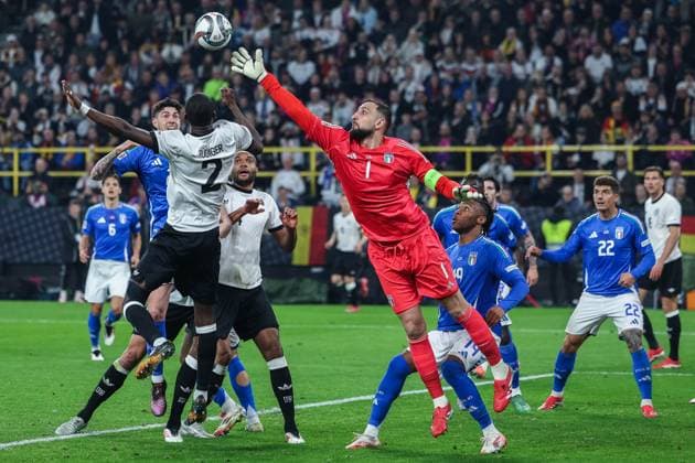 Soccer UEFA Nations League quarter final Germany Italy on 23 03 2025 at Signal Iduna Park in Dortmund Antonio Rüdiger Germany , left Gianluigi Donnarumma Italy , right at a corner xJRx