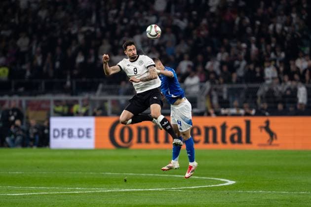 GER, Nations League, Germany vs. Italy 23 03 2025, Signal Iduna Park, Dortmund, GER, Nations League, Germany vs. Italy in picture Header duel Header duel between Tim Kleindienst Germany, 9 and Alessandro Buongiorno Italy ITA, 4 nordphotoxGmbHxx xChristianxSchulze nph000300