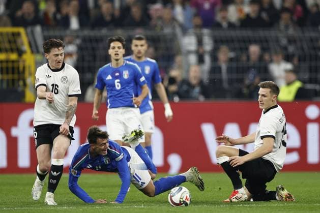 DORTMUND - (l-r) Daniel Maldini of Italy, Nico Schlotterbeck of Germany during the UEFA Nations League quarterfinal match between Germany and Italy at the BVB Stadion Dortmund on March 23, 2025 in Dortmund, Germany. ANP Hollandse Hoogte MAURICE VAN STEEN UEFA Nations League Quarterfinal Leg Two 2025 xVIxANPxSportx xMauricexvanxSteenxIVx 522966936 originalFilename: 522966936.jpg