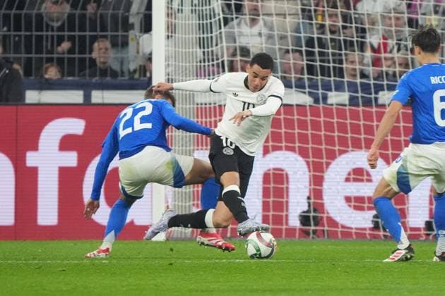 Jamal Musiala Germany, Germany, 10 is fouled by Giovanni Lorenzo Italy, Italy, Italia, 22 , but the referee lets Dortmund 23 03 2025 Germany v Italy, UEFA Nations League quarter-final second leg, Signal Iduna Park