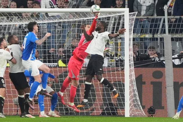 Goalkeeper Goalie Gianluigi Donnarumma Italy, Italy, Italia, 01 clears in front of Antonio Rüdiger Germany Germany, 2 Dortmund 23 03 2025 Germany vs Italy, UEFA Nations League quarter-final second leg, Signal Iduna Park