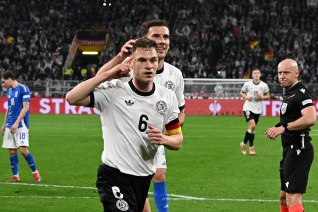 23 03 2025, xsltx, Football UEFA Nations League, Germany Italy v l Goal celebration after the goal to celebrate the goal celebrate 1 0 by Joshua Kimmich German National Football Team DFB DFL DFB REGULATIONS PROHIBIT ANY USE OF PHOTOGRAPHS as IMAGE SEQUENCES and or QUASI VIDEO Dortmund