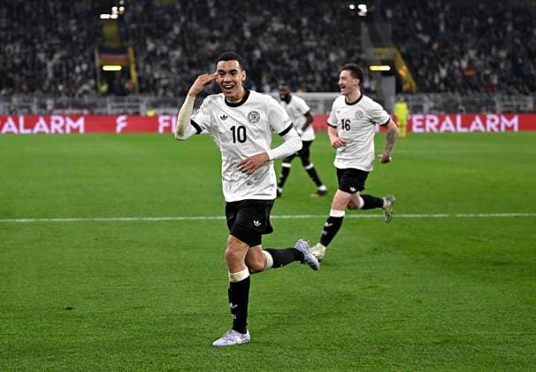 23 03 2025, Football UEFA Nations League 2024 25, quarter-final, Germany Italy, in Dortmund, Signal Iduna Stadion, cheering scorer Jamal Musiala Germany to score 2 0