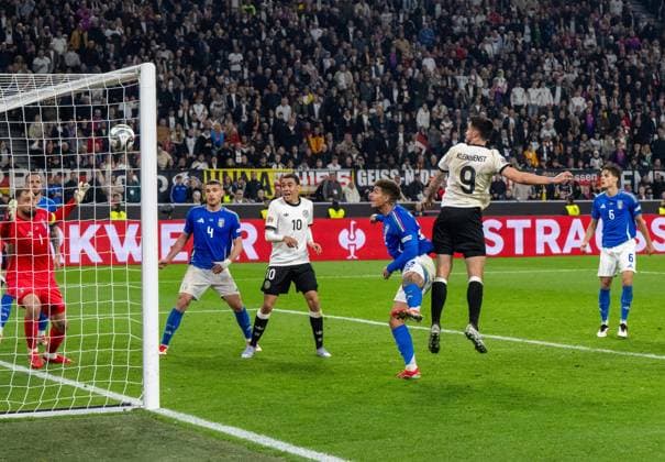 Soccer, Men, 2024 25 season, UEFA Nations League quarter-final second leg in Dortmund, Germany Italy, Tim Kleindienst Germany scores the goal to make it 3-0 against goalkeeper Gianluigi Donnarumma Italy and Giovanni Di Lorenzo Italy , 23 03 2025, Copyright: xMatthiasxKochx