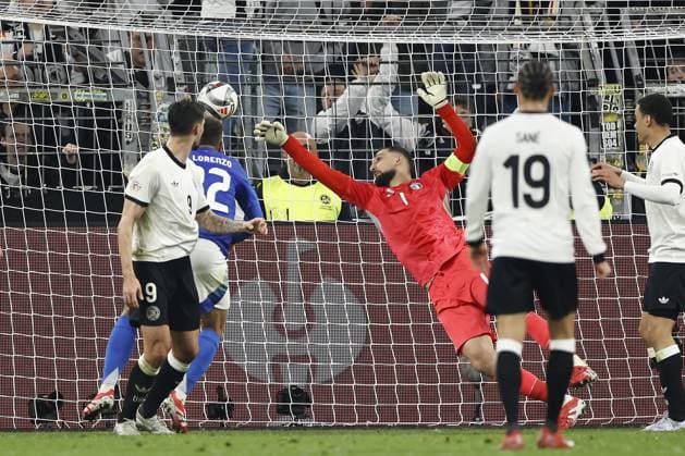 DORTMUND - (l-r) Tim Kleindienst of Germany scores 3-0, Giovanni Di Lorenzo, Italy goalkeeper Gianluigi Donnarumma of Italy during the UEFA Nations League quarterfinal match between Germany and Italy at the BVB Stadium Dortmund on March 23, 2025 in Dortmund, Germany. ANP Hollandse Hoogte MAURICE VAN STEEN UEFA Nations League Quarterfinal Leg Two 2025 xVIxANPxSportx xMauricexvanxSteenxIVx 522969327 originalFilename: 522969327.jpg