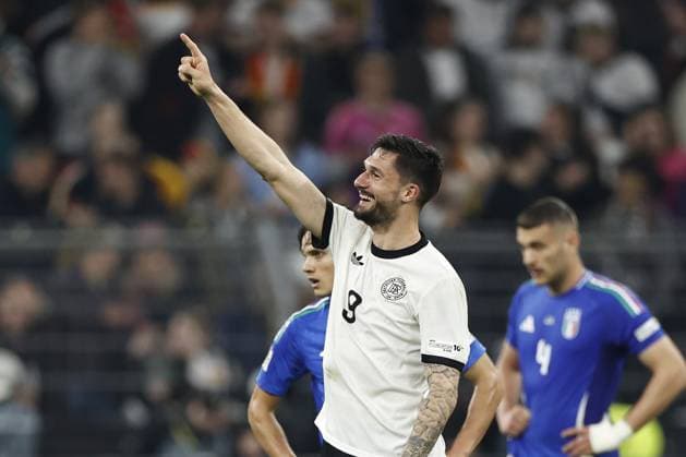 DORTMUND - (l-r) Samuele Ricci of Italy balks, Tim Kleindienst of Germany celebrates the 3-0 during the UEFA Nations League quarterfinal match between Germany and Italy at the BVB Stadion Dortmund on March 23, 2025 in Dortmund, Germany. ANP Hollandse Hoogte MAURICE VAN STEEN UEFA Nations League Quarterfinal Leg Two 2025 xVIxANPxSportx xMauricexvanxSteenxIVx 522969715 originalFilename: 522969715.jpg