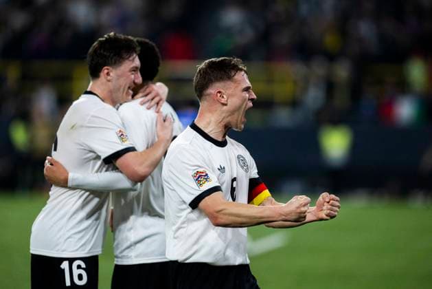 Signal Iduna Park, Dortmund, 23 03 2025 Jamal Musiala of Germany M celebrates scoring the 2 0 goal with Angelo Stiller of Germany and Joshua Kimmich of Germany during the UEFA Nations League Quarterfinal Match Germany v Italia