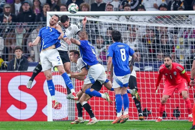 23 03 2025, Football, Quarter-final UEFA Nations League, Germany Italy, Signal Iduna Park, Season 2024 2025 Goalkeeper Ricardo Calafiori ITA 05 and Alessandro Buongiorno ITA 04 in duel against Tim Kleindienst GER 09 Header penalty area action DFB regulations prohibit any use of photographs as image sequences and or quasi video Nordrhein Westfalen Germany