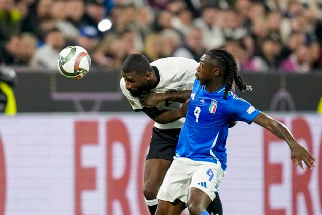 Antonio Ruediger Germany un d Moise Kean Italy battle for the ball during the UEFA Nations League Quarterfinal Leg Two match between Germany and Italy at Football Stadium Dortmund on March 23, 2025 in Dortmund, Germany