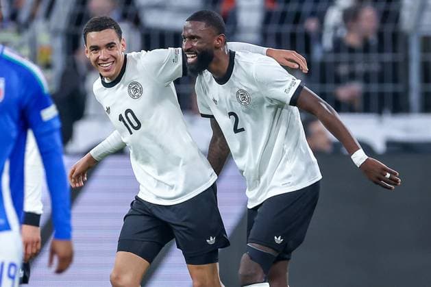 23 03 2025, Football, Quarter-final UEFA Nations League, Germany Italy, Signal Iduna Park, Season 2024 2025 Goal celebration after the 2-0 goal by scorer Jamal Musiala GER 10 together with Antonio Rüdiger GER 02 DFB regulations prohibit any use of photographs as image sequences and or quasi video North Rhine-Westphalia Germany