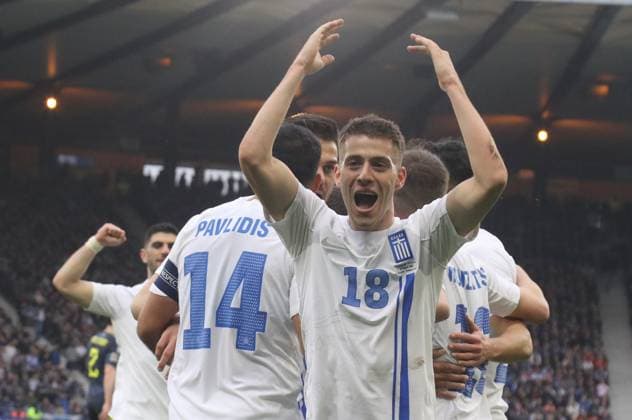 Giannis Konstantelias of Greece celebrates with his teammates after scoring during the UEFA Nations League play-offs 2st leg soccer match between Scotland and Greece in Hampden Park, Glasgow, Scotland, on 23 March 2025. IMAGO ONE INCH PRODUCTIONS GLASCOW SCOTLAND Copyright: xOnexInchxProductionsx 6512335