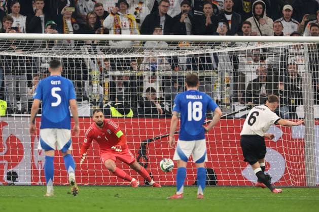 Dortmund, Germany, 23rd March 2025. Joshua Kimmich of Germany scores a penalty to give the hosts a 1-0 lead during the UEFA Nations League match Germany vs Italy at BVB Stadion, Dortmund. Picture credit should read: Jonathan Moscrop Sportimage EDITORIAL USE ONLY. No use with unauthorised audio, video, data, fixture lists, club league logos or live services. Online in-match use limited to 120 images, no video emulation. No use in betting, games or single club league player publications. SPI_020_JM_GERMANY_ITALY_UNL_ SPI-3750-0020