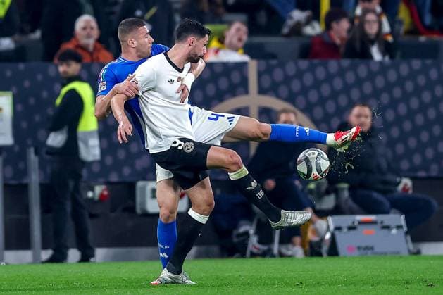 23 03 2025, Football, Quarter-final UEFA Nations League, Germany Italy, Signal Iduna Park, Season 2024 2025 Alessandro Buongiorno ITA 04 in duel against Tim Kleindienst GER 09 DFB regulations prohibit any use of photographs as image sequences and or quasi video Nordrhein Westfalen Germany