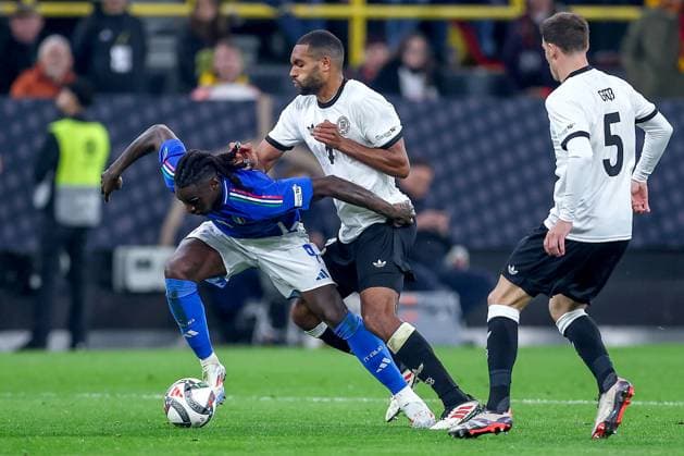 23 03 2025, Football, Quarter-final UEFA Nations League, Germany Italy, Signal Iduna Park, Season 2024 2025 Moise Kean ITA 09 in duel against Jonathan Tah GER 04 DFB regulations prohibit any use of photographs as image sequences and or quasi video Nordrhein Westfalen Germany