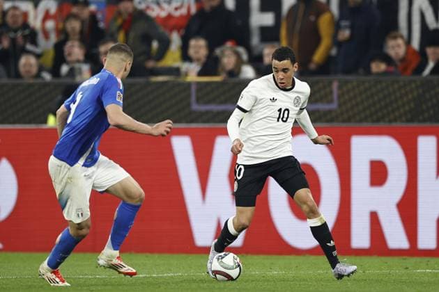 DORTMUND - (l-r) Alessandro Buongiorno of Italy, Jamal Musiala of Germany during the UEFA Nations League quarterfinal match between Germany and Italy at the BVB Stadion Dortmund on March 23, 2025 in Dortmund, Germany. ANP Hollandse Hoogte MAURICE VAN STEEN UEFA Nations League Quarterfinal Leg Two 2025 xVIxANPxSportx xMauricexvanxSteenxIVx 522974372 originalFilename: 522974372.jpg