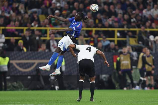 Moise Kean Italy and Jonathan Tah Germany battle for the ball during the UEFA Nations League Quarterfinal Leg Two match between Germany and Italy at Football Stadium Dortmund on March 23, 2025 in Dortmund, Germany Photo by Oliver Kaelke DeFodi Images