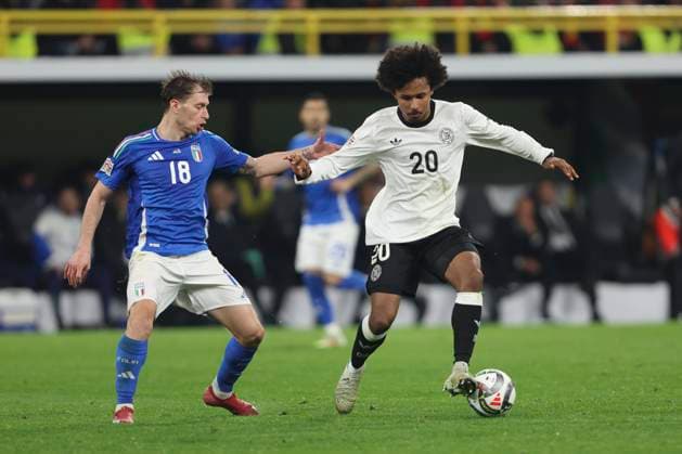 Nicolo Barella Italy and Karim Adeyemi Germany battle for the ball during the UEFA Nations League Quarterfinal Leg Two match between Germany and Italy at Football Stadium Dortmund on March 23, 2025 in Dortmund, Germany Photo by Oliver Kaelke DeFodi Images