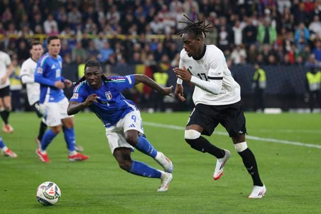 Moise Kean Italy and Yann Bisseck Germany battle for the ball during the UEFA Nations League Quarterfinal Leg Two match between Germany and Italy at Football Stadium Dortmund on March 23, 2025 in Dortmund, Germany Photo by Oliver Kaelke DeFodi Images