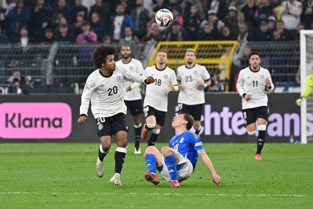 23 03 2025, xjrdrx, Football UEFA Nations League, Germany Italy v l Karim Adeyemi German National Football Team DFB Nicolo Barella Italy duel, action, action, battle for the ball DFL DFB REGULATIONS PROHIBIT ANY USE OF PHOTOGRAPHS as IMAGE SEQUENCES and or QUASI VIDEO Dortmund