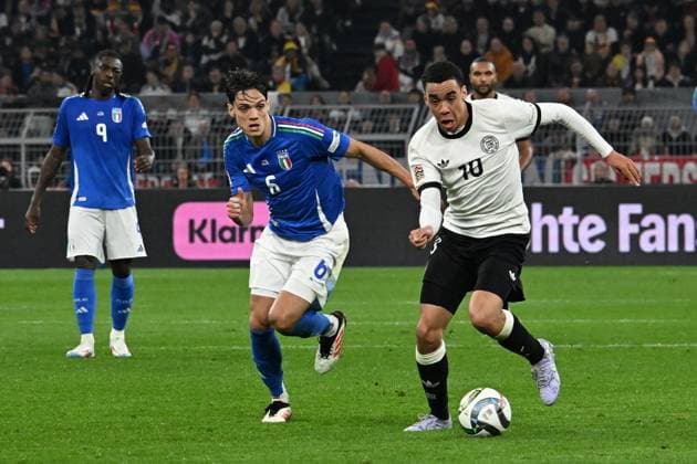 23 03 2025, xsltx, Football UEFA Nations League, Germany Italy v l Samuele Ricci Italy Jamal Musiala German National Football Team DFB Zweikampf, Aktion, action, battle for the ball DFL DFB REGULATIONS PROHIBIT ANY USE OF PHOTOGRAPHS as IMAGE SEQUENCES and or QUASI VIDEO Dortmund