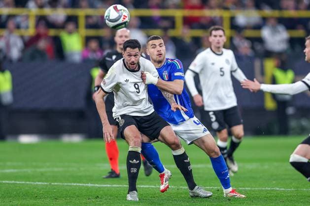 23 03 2025, Football, Quarter-final UEFA Nations League, Germany Italy, Signal Iduna Park, Season 2024 2025 Tim Kleindienst GER 09 in duel against Alessandro Buongiorno ITA 04 DFB regulations prohibit any use of photographs as image sequences and or quasi video Nordrhein Westfalen Germany