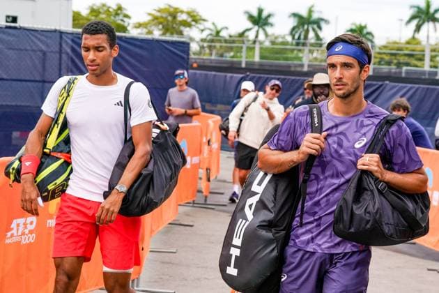 March 23, 2025, Miami, Florida, USA: Felix Auger-Aliassime (CAN) (L) and Lorenzo Musetti (ITA) arrive for the men s singles third round match at the 2025 Miami Open presented by Itau at Hard Rock Stadium. Miami USA - ZUMAw109 20250323_fap_w109_021 Copyright: xDebbyxWongx