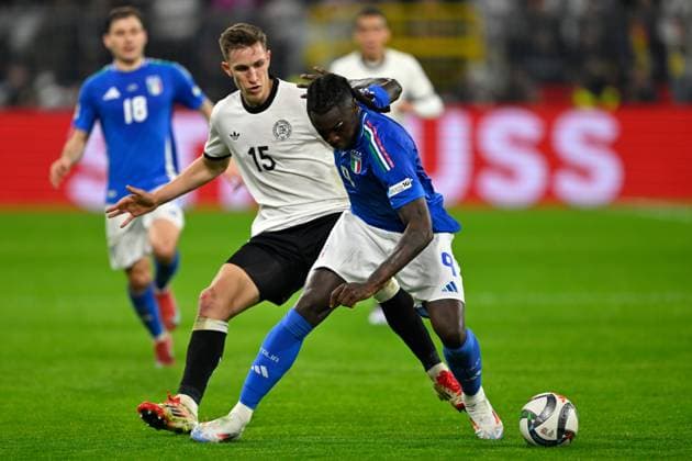(250324) -- DORTMUND, March 24, 2025 -- Nico Schlotterbeck (L) of Germany vies with Moise Kean of Italy during the UEFA Nations League quarterfinal 2nd leg football match between Germany and Italy in Dortmund, Germany, March 23, 2025. (Photo by Xinhua) (SP)GERMANY-DORTMUND-FOOTBALL-UEFA NATIONS LEAGUE-GERMANY VS ITALY UlrichxHufnagel 