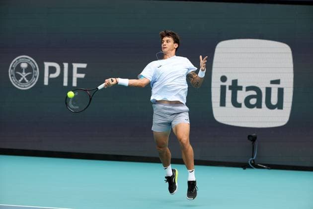 March 23, 2025, Miami Gardens, Florida, United States Of America: MIAMI GARDENS, FLORIDA - MARCH 23: Novak Djokovic of Serbia defeats Camilo Ugo Carabelli of Argentina during Day 6 of the Miami Open at Hard Rock Stadium on March 23, 2025 in Miami Gardens, Floriida...People: Camilo Ugo Carabelli Miami Open 2025 - Day 6  - ZUMAs214 20250323_ada_s214_035 Copyright: xSMGx