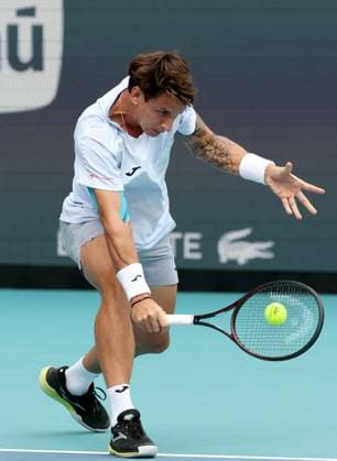 March 23, 2025, Miami Gardens, Florida, United States Of America: MIAMI GARDENS, FLORIDA - MARCH 23: Novak Djokovic of Serbia defeats Camilo Ugo Carabelli of Argentina during Day 6 of the Miami Open at Hard Rock Stadium on March 23, 2025 in Miami Gardens, Floriida...People: Camilo Ugo Carabelli Miami Open 2025 - Day 6  - ZUMAs214 20250323_ada_s214_042 Copyright: xSMGx