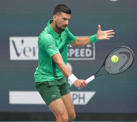 March 23, 2025, Miami Gardens, Florida, United States Of America: MIAMI GARDENS, FLORIDA - MARCH 23: Novak Djokovic of Serbia defeats Camilo Ugo Carabelli of Argentina during Day 6 of the Miami Open at Hard Rock Stadium on March 23, 2025 in Miami Gardens, Floriida...People: Novak Djokovic Miami Open 2025 - Day 6  - ZUMAs214 20250323_ada_s214_083 Copyright: xSMGx