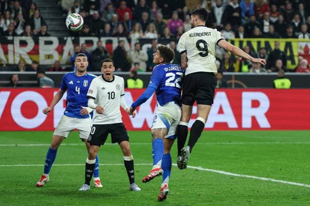 UEFA Nations League 24 25 Germany Italy on 23 03 2025 at Signal Iduna Park in Dortmund Tim Kleindienst Germany 9 scores against Giovanni Di Lorenzo Italy 22 to make it 3 - 0, Jamal Musiala Germany 10 and Alessandro Buongiorno Italy 4 watch the scene MH