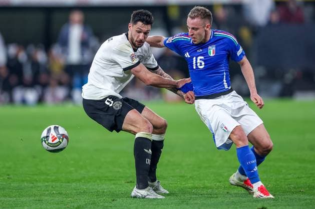 23 03 2025, Football, Quarter-final UEFA Nations League, Germany Italy, Signal Iduna Park, Season 2024 2025 Tim Kleindienst GER 09 in duel against Davide Frattesi ITA 16 DFB regulations prohibit any use of photographs as image sequences and or quasi video Nordrhein Westfalen Germany
